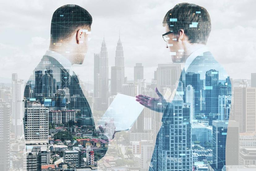 Businessmen Silhouettes Working Together On Blurry Kuala Lumpur City Background With Daylight